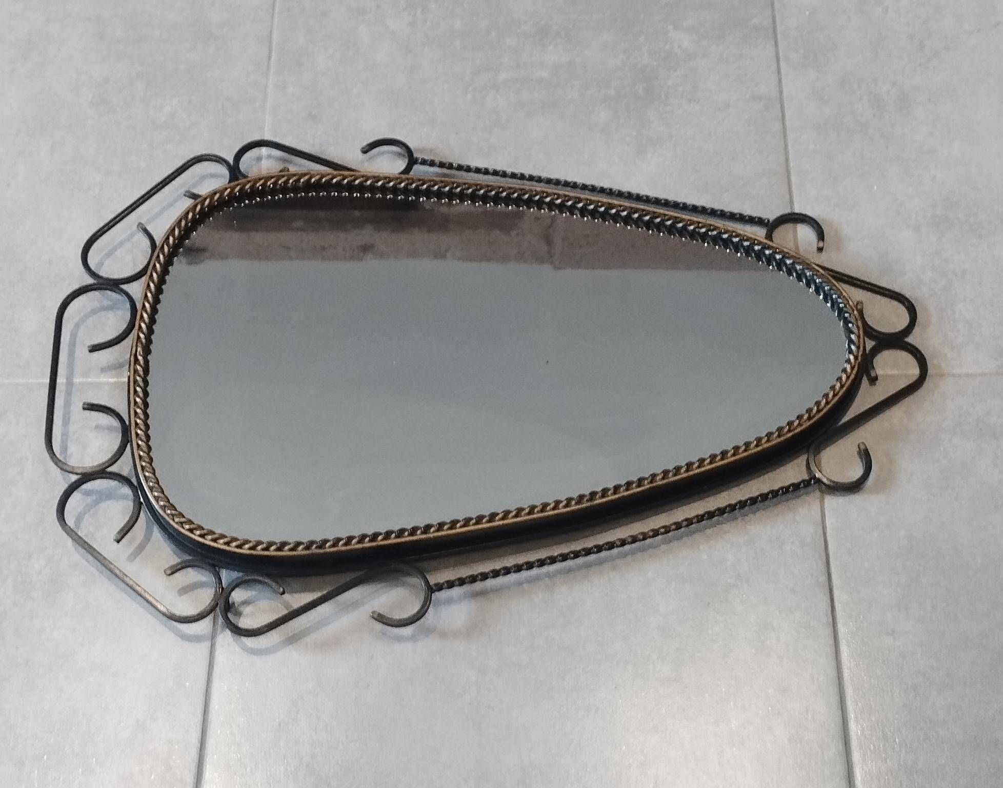 Mid-century modern iron mirror, brutalist, vintage organic, thick sixties.