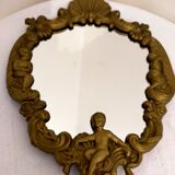 Gilded bronze mirror with angels and scrolls