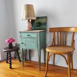 Patinated bedside table end of sofa