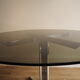 Smoked glass round dining table