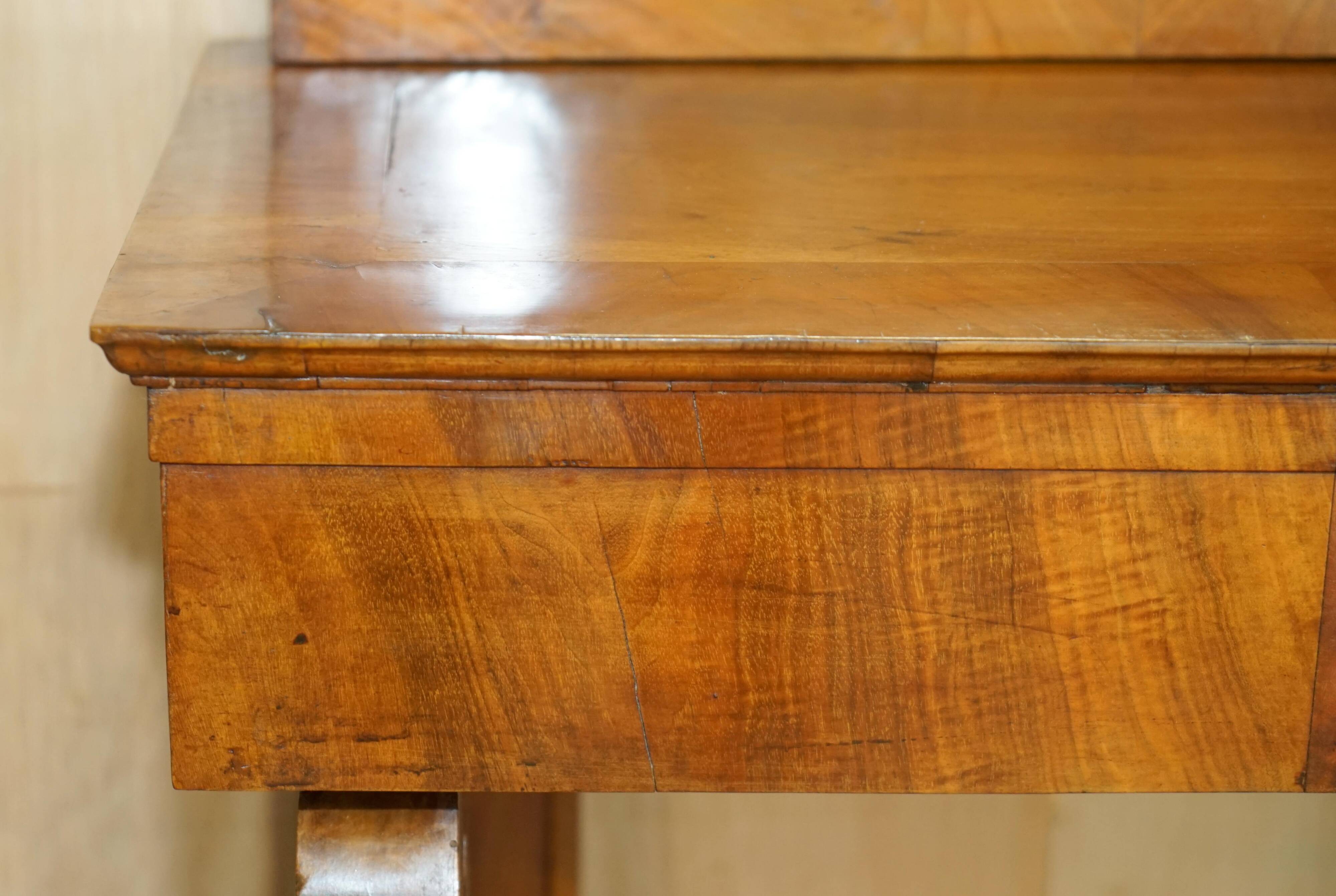 Pair of restored antique consoles from around 1815 in walnut, Regency style with mirror.