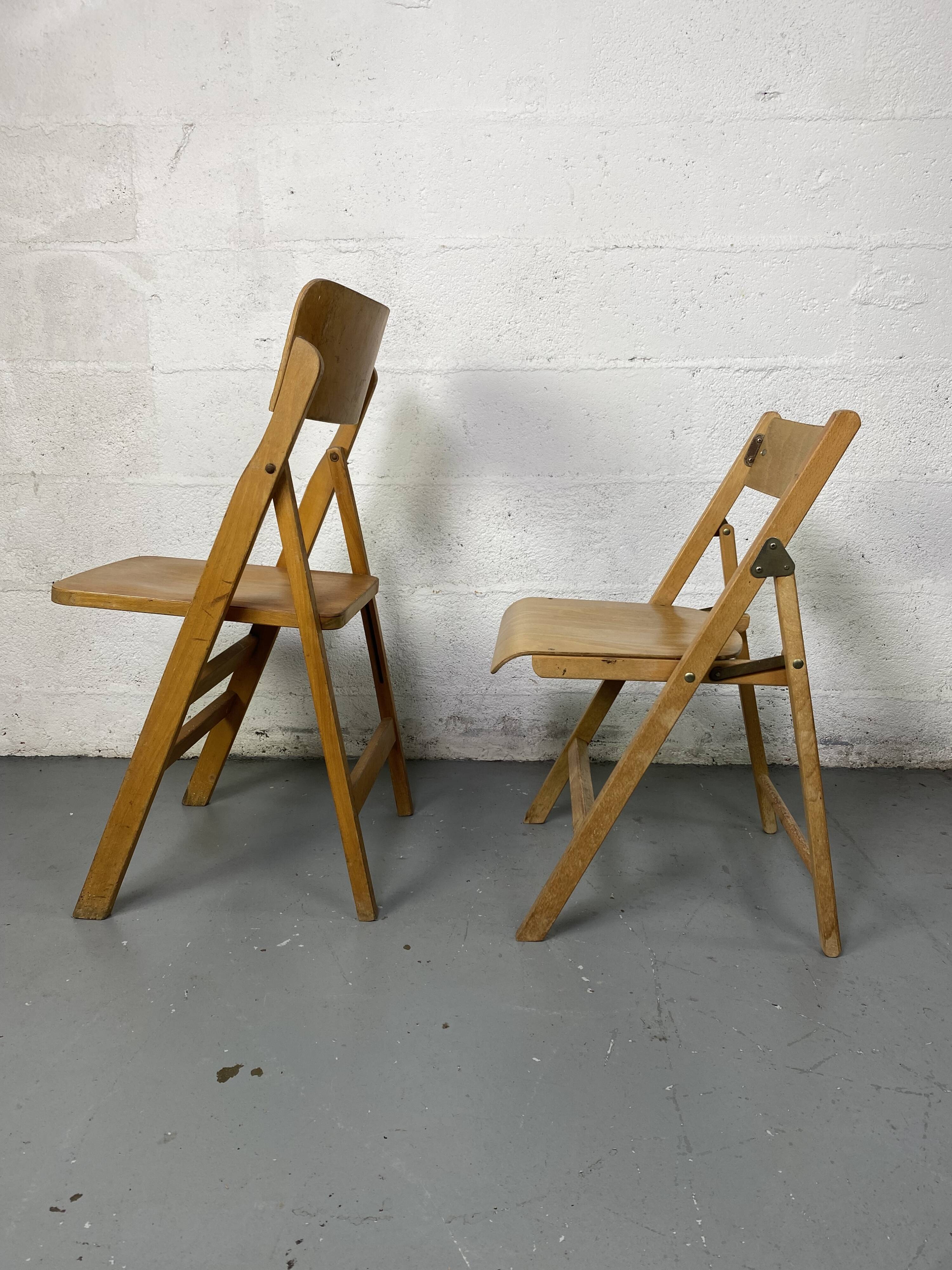 Pair of mismatched wooden folding chairs