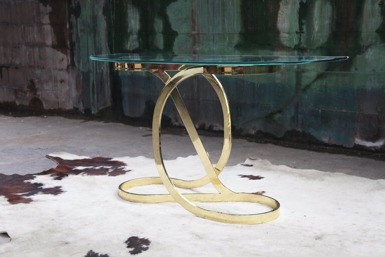 Brass ribbon console table Design Institute of America