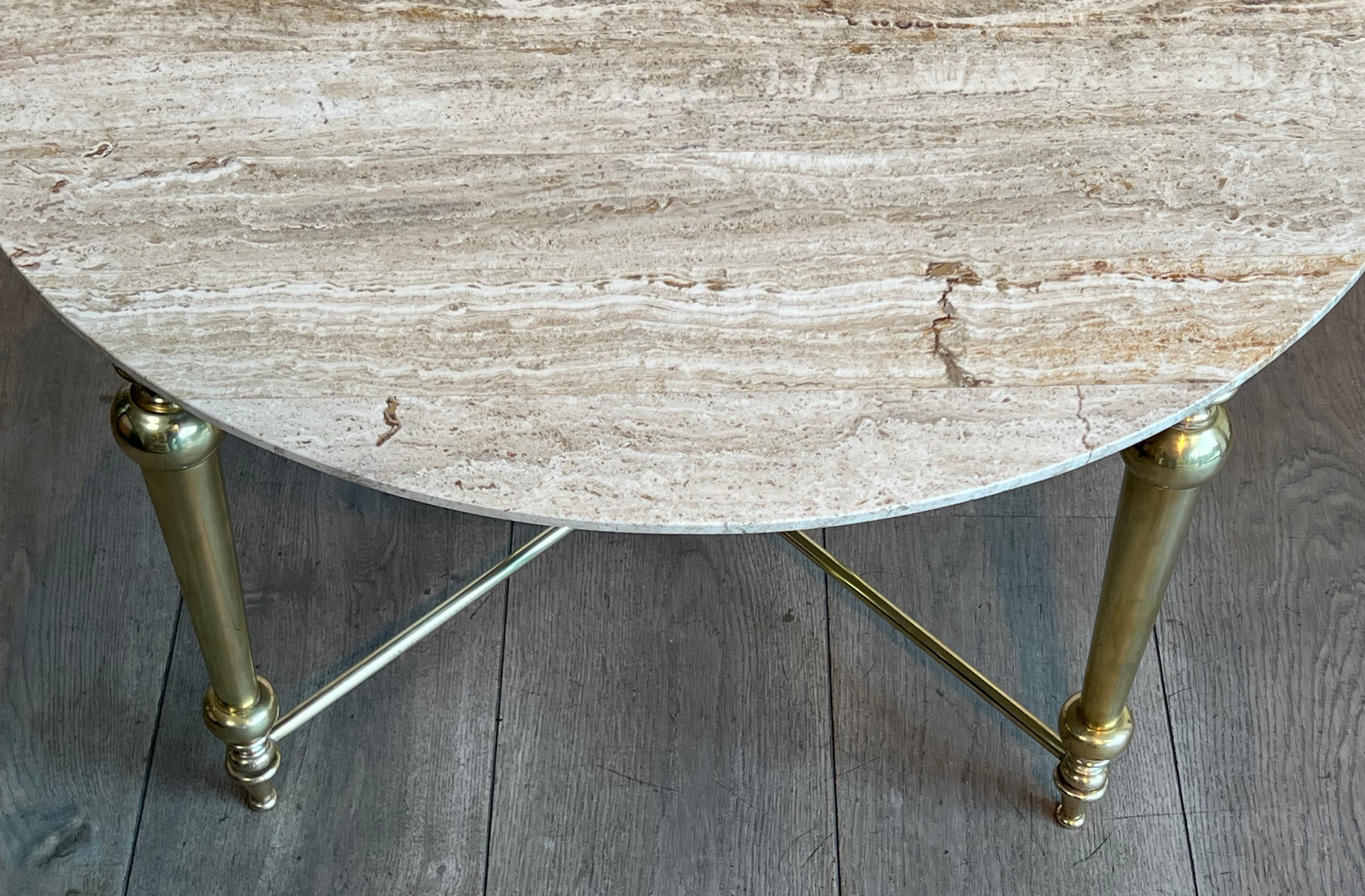 Brass coffee table with a white marble top.