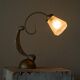 Sculptural table lamp in brass and opaline glass, early 20th century.