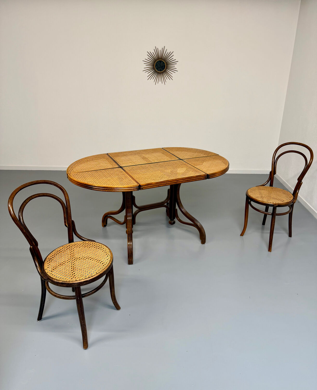 Vintage dining table with a cane top by Mundus from the 1970s.