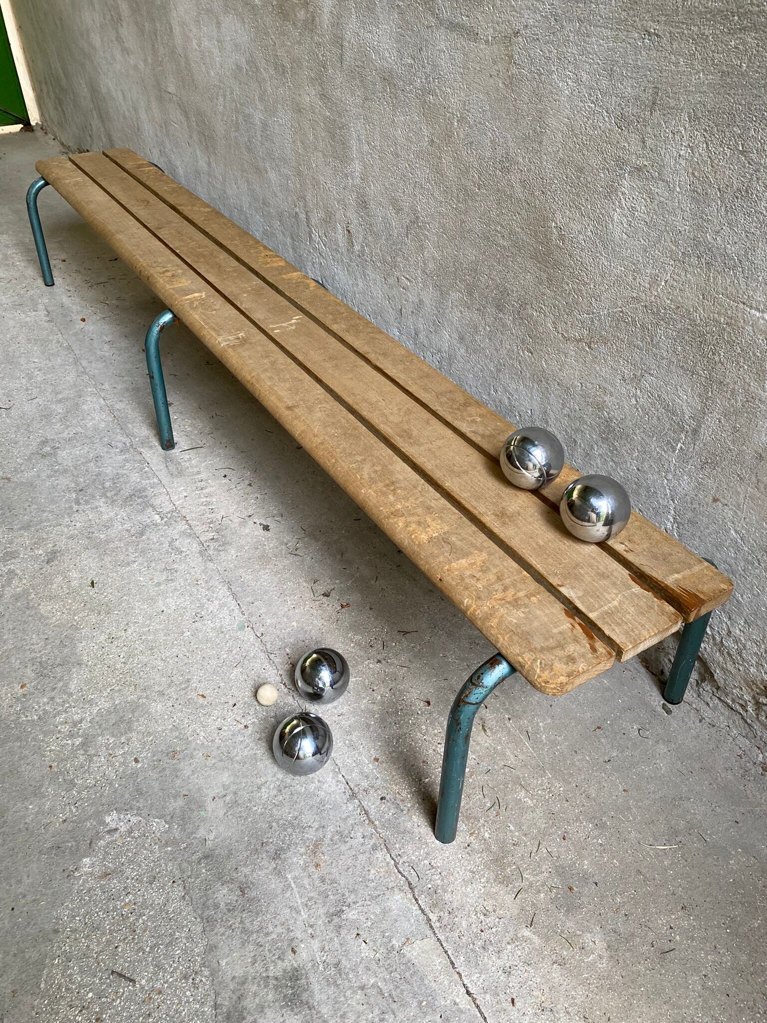 Vintage wood kindergarten bench and tubular structure in long