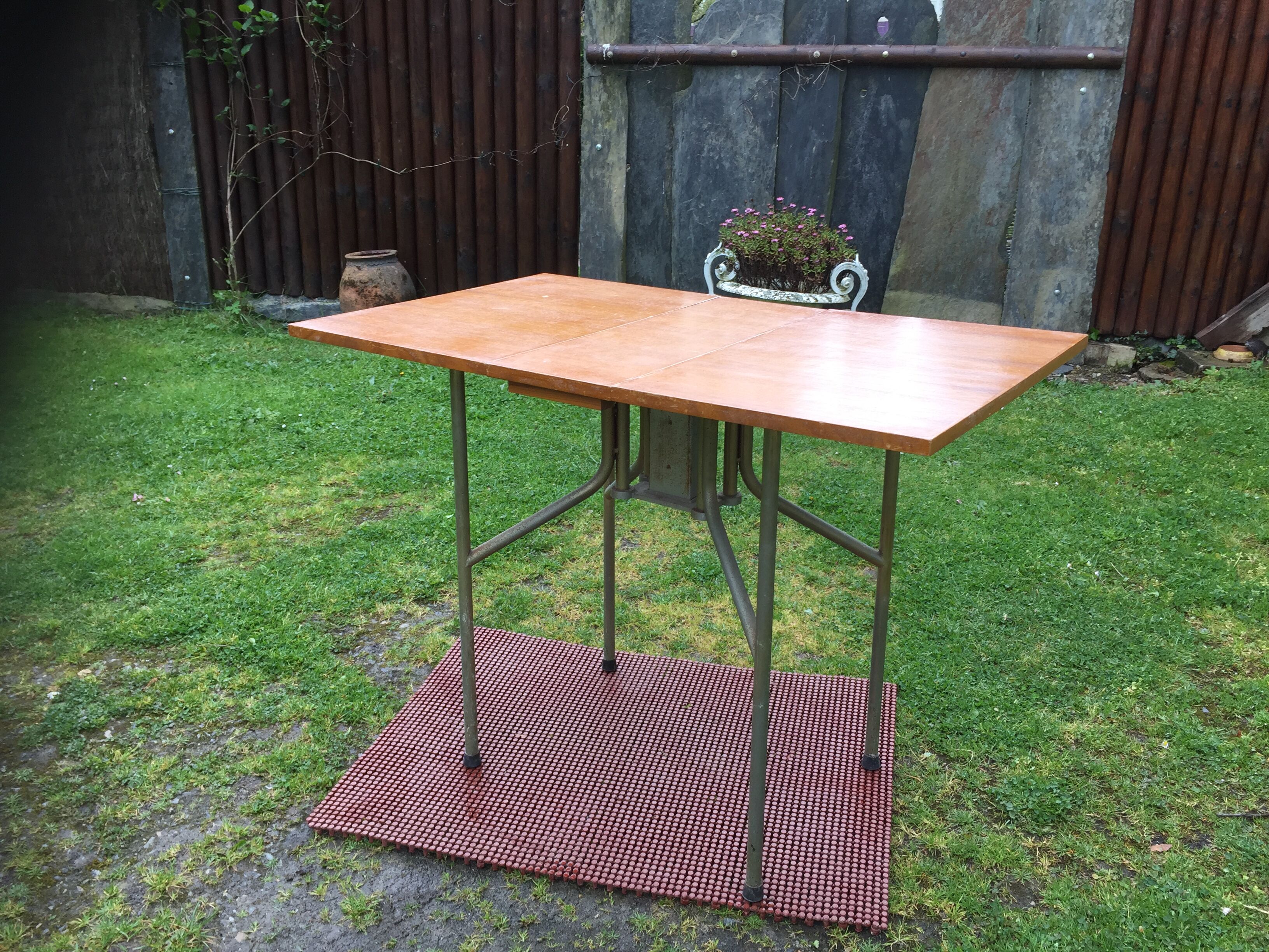 Vintage folding table with teak flaps said wallet with metal tubular base