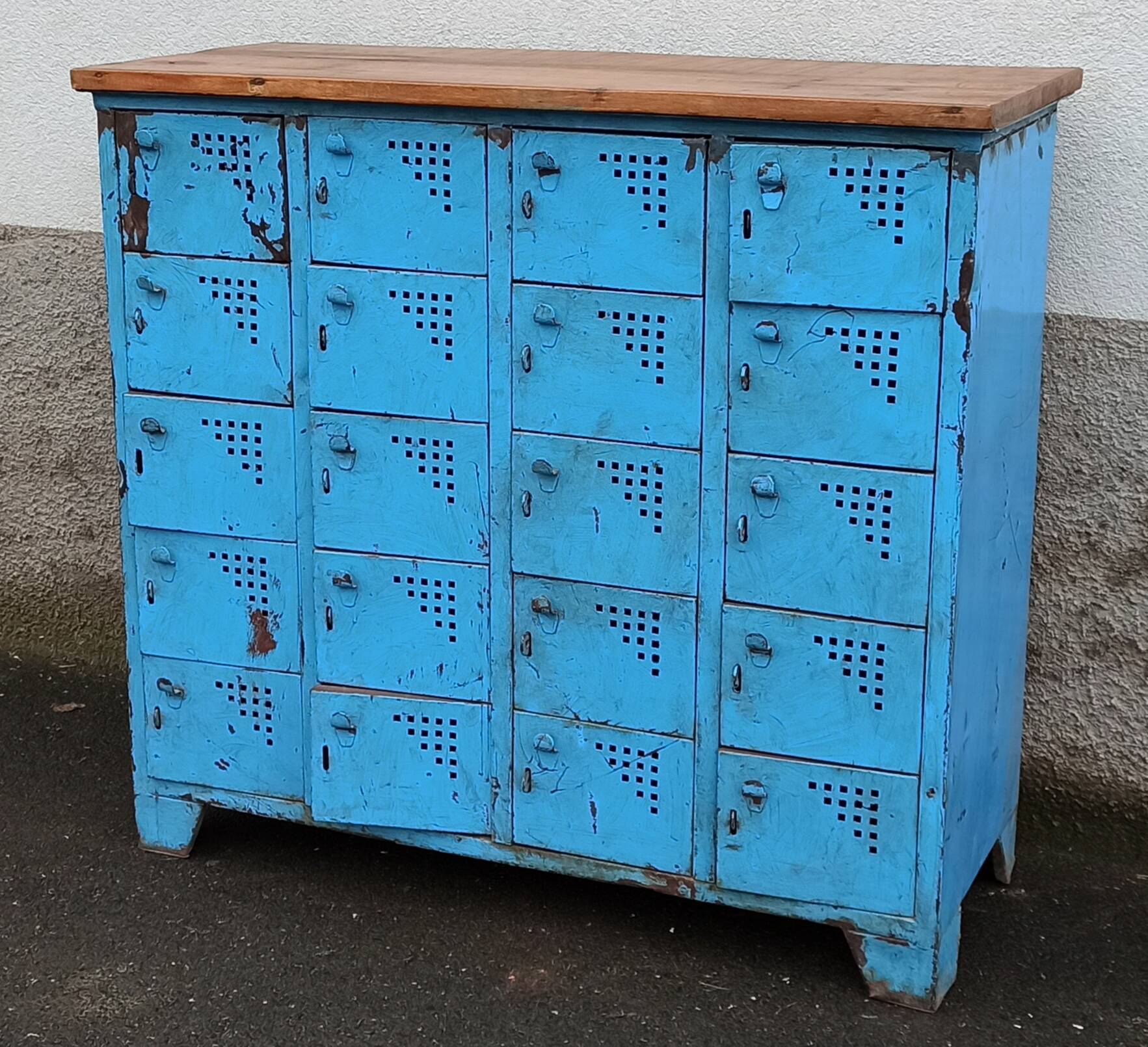 Old blue metal locker with wooden top