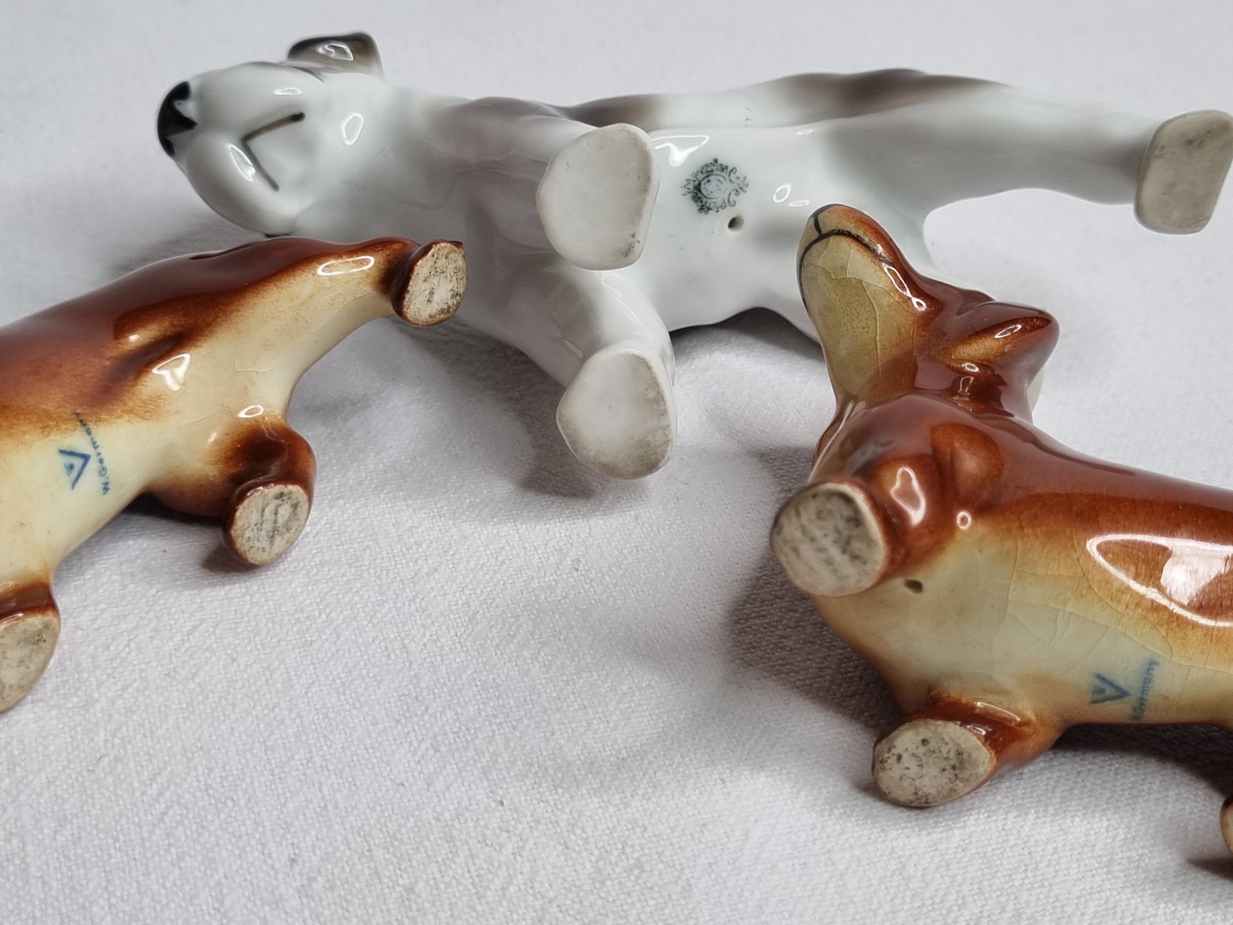 Set of three porcelain puppies