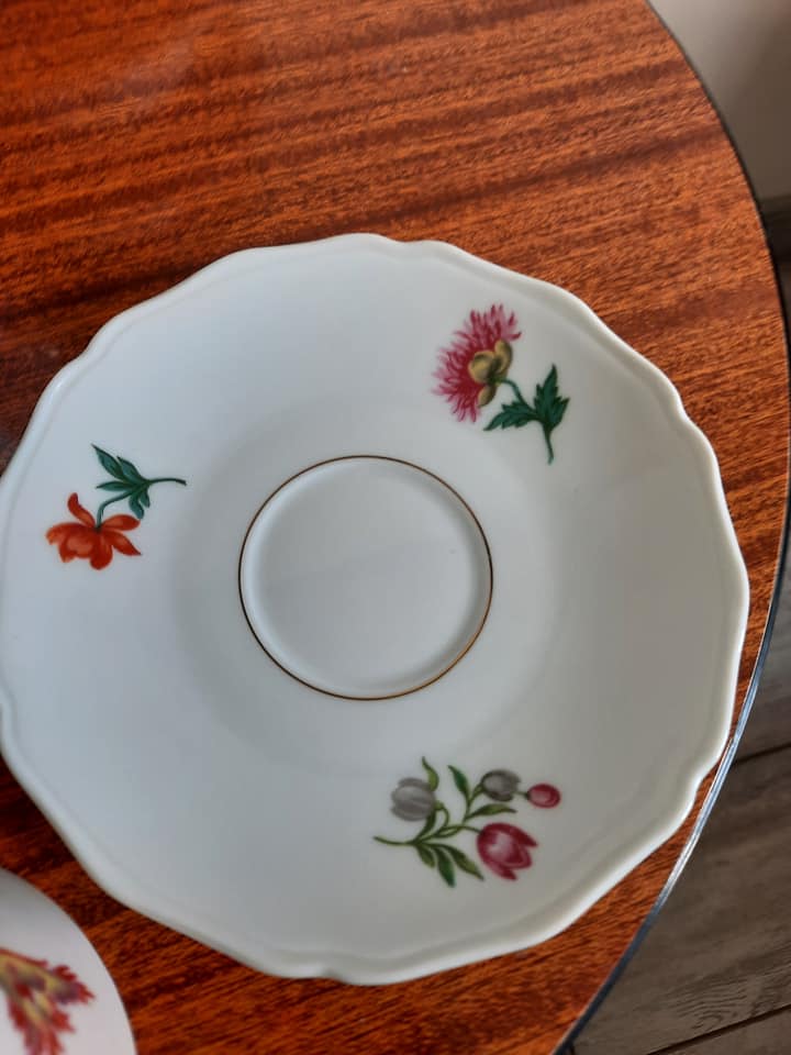 10 porcelain tea cups and 1 milk pot