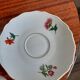 10 porcelain tea cups and 1 milk pot