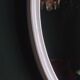 Large oval mirror in vintage white enamelled cast iron