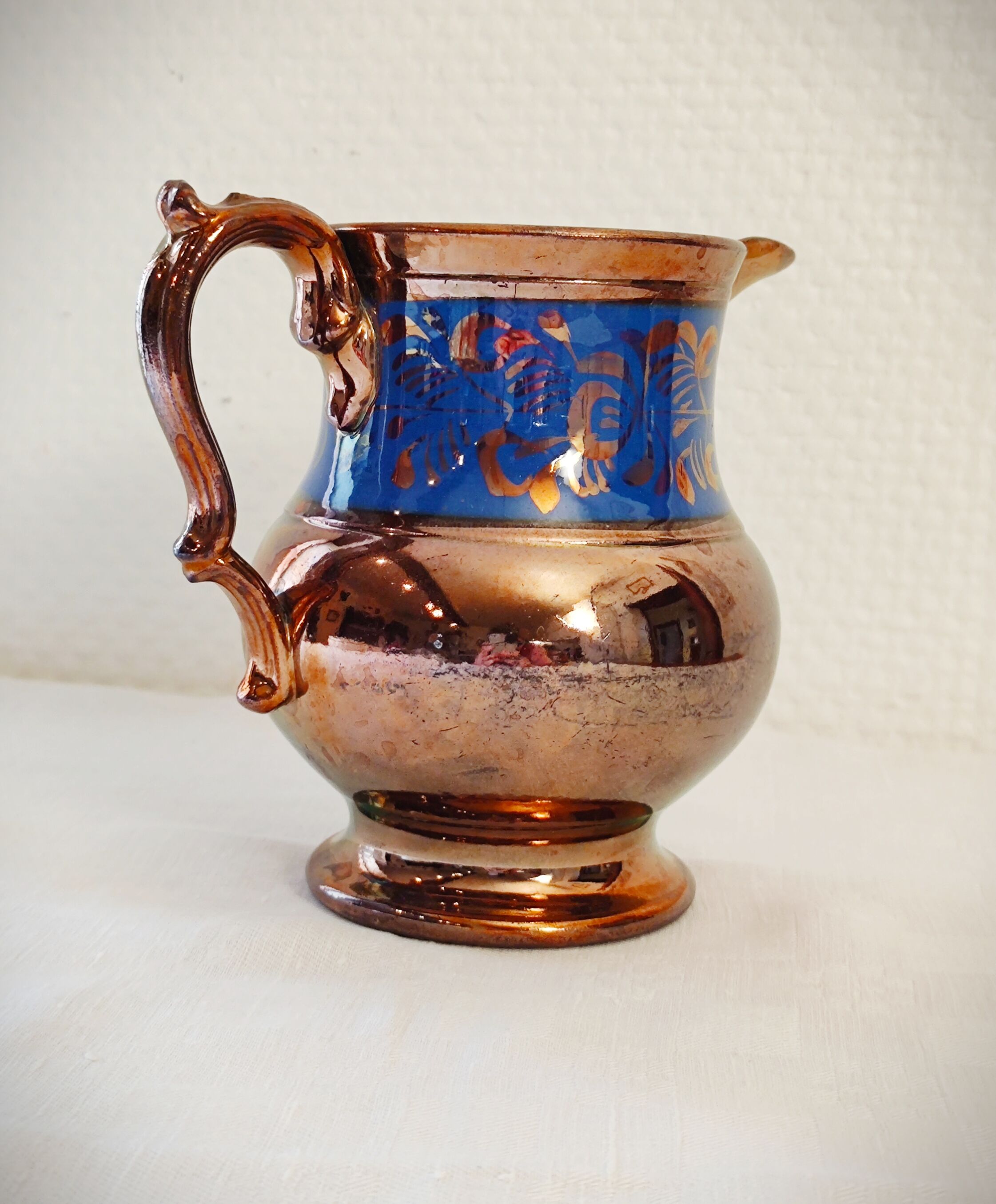 Copper and blue jersey ceramic pitcher