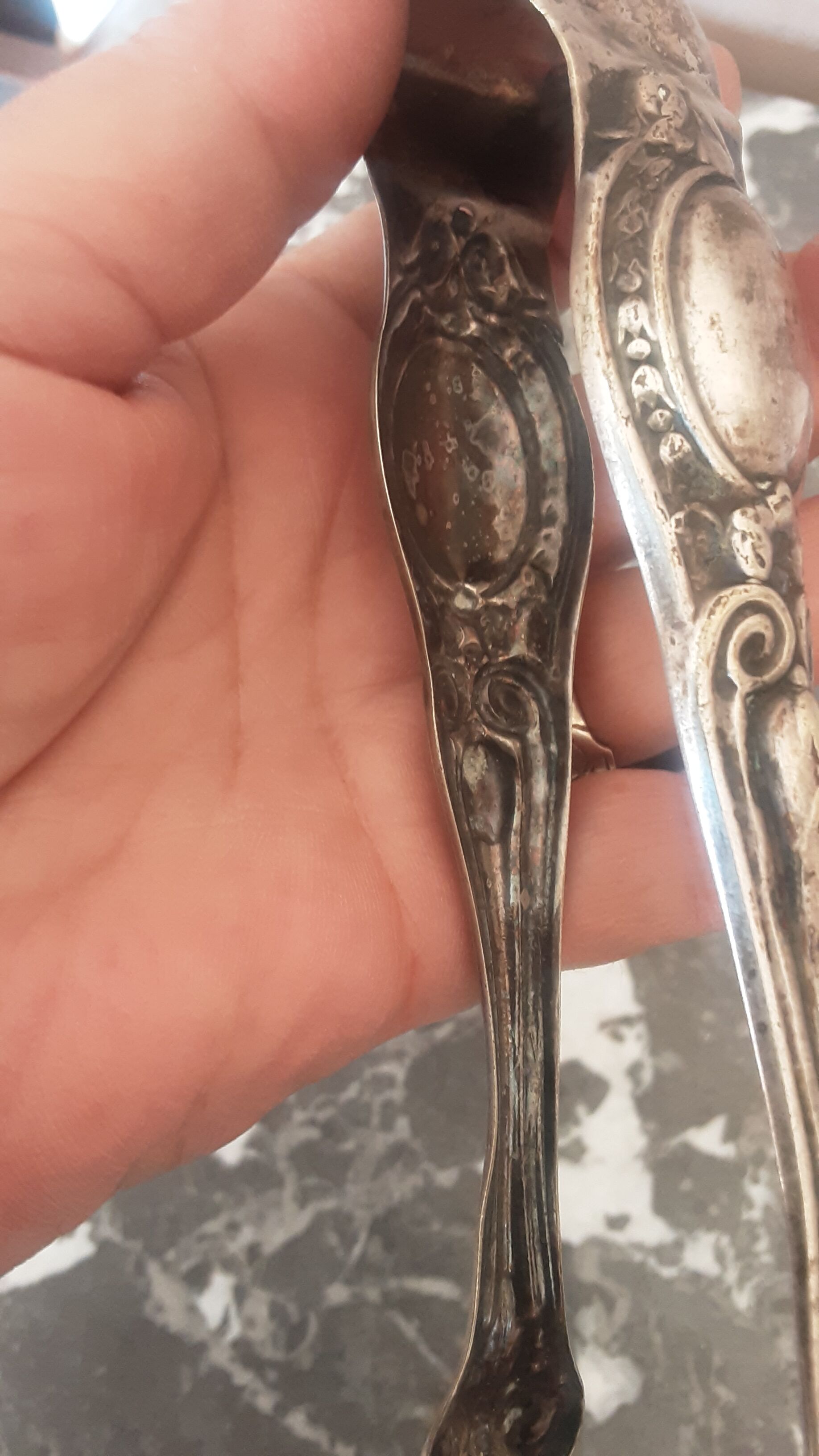 Antique silver metal sugar clamp