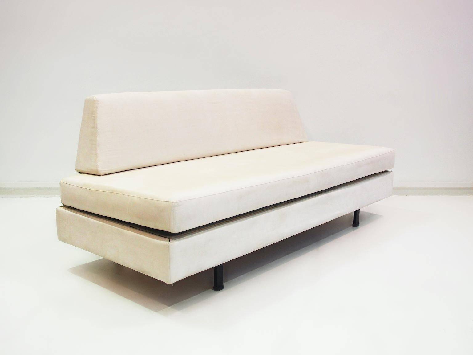 Italian modernist daybed with white upholstery and iron frame.