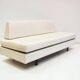 Italian modernist daybed with white upholstery and iron frame.