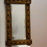 Brutalist mirror with a hammered copper and brass frame.