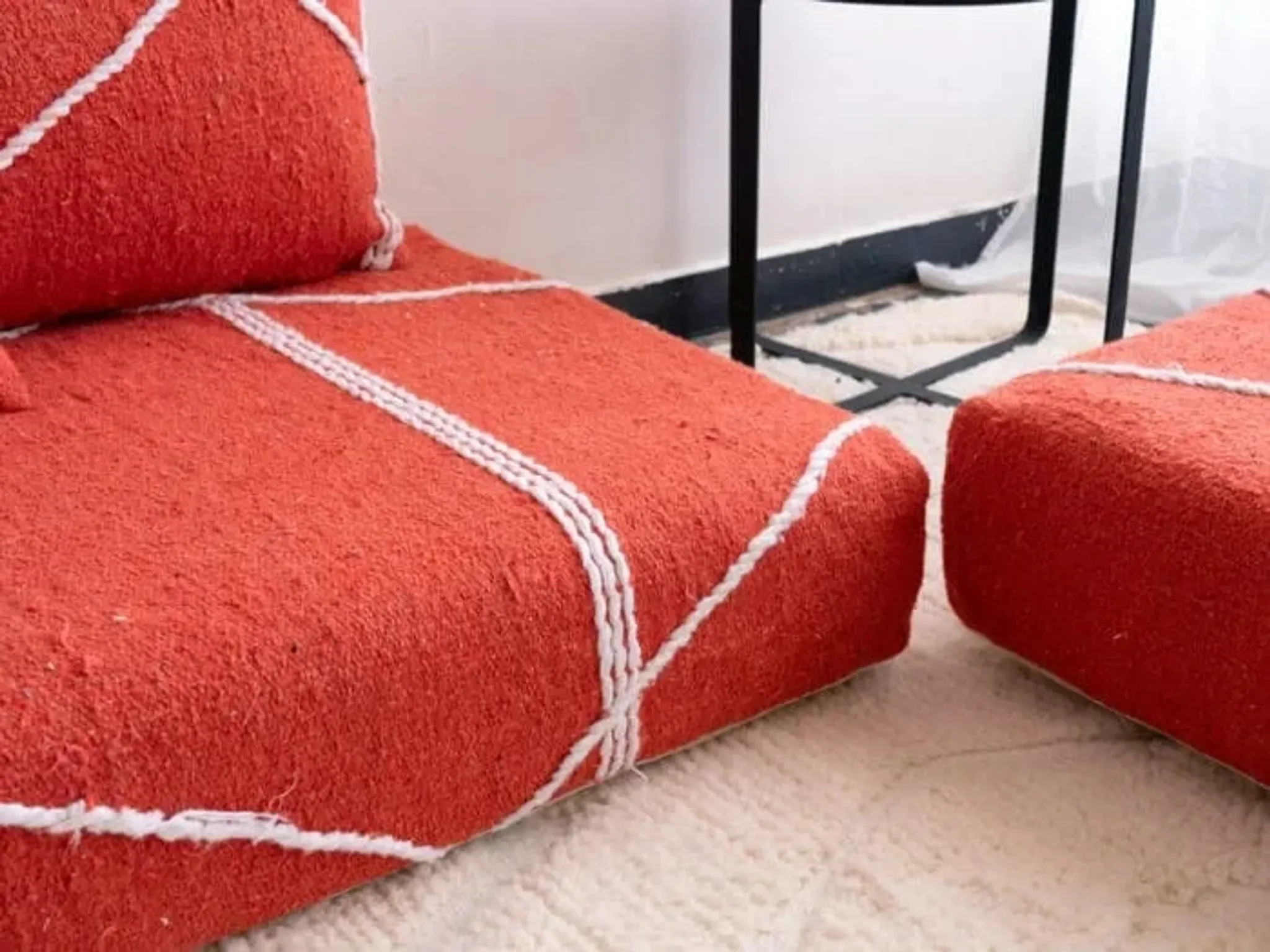 Handmade Moroccan floor cushion in orange cotton.