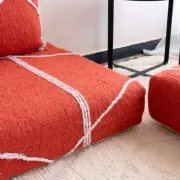 Handmade Moroccan floor cushion in orange cotton.