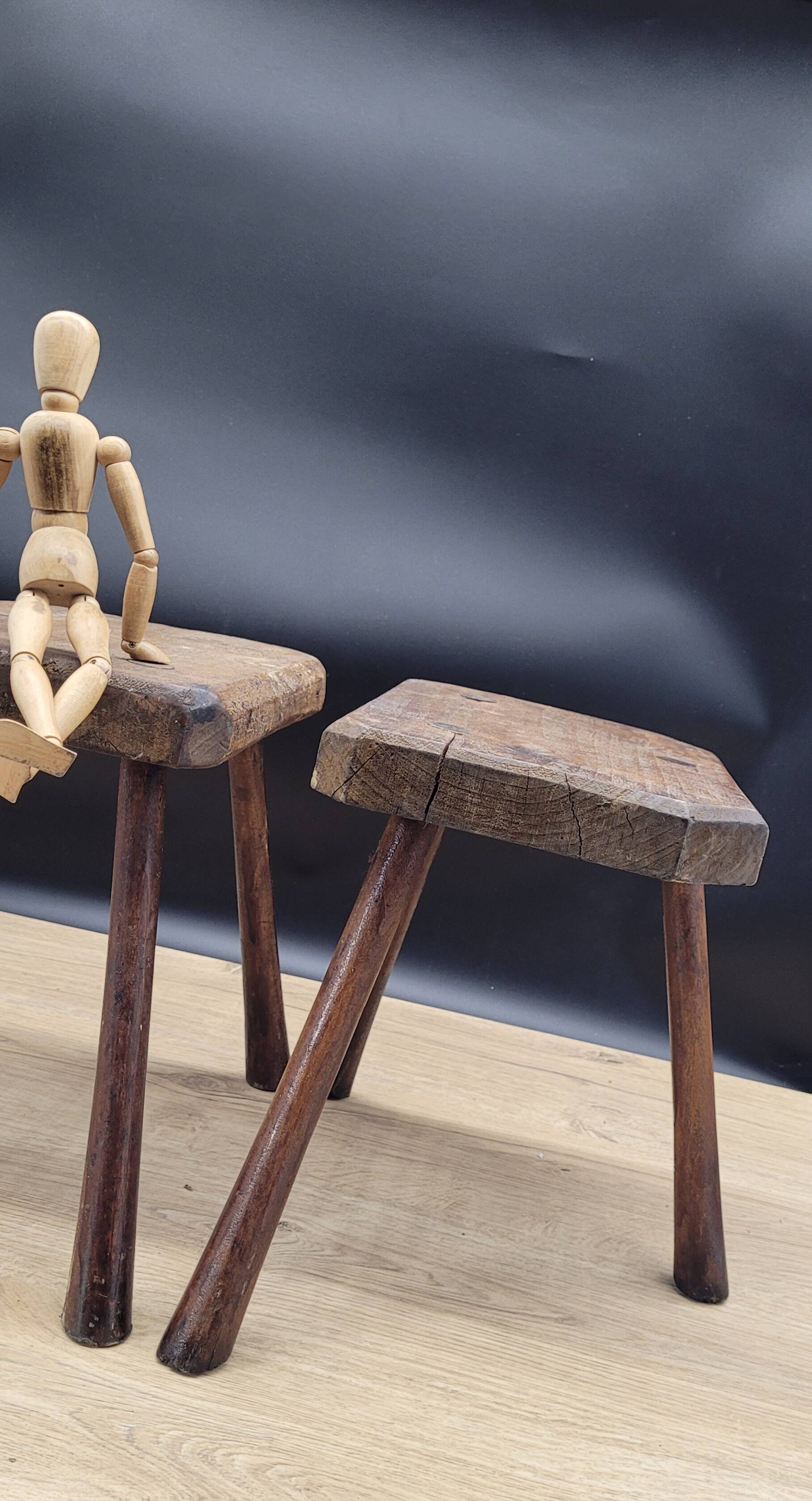 Pair of solid octagon cowhide tripod stools
