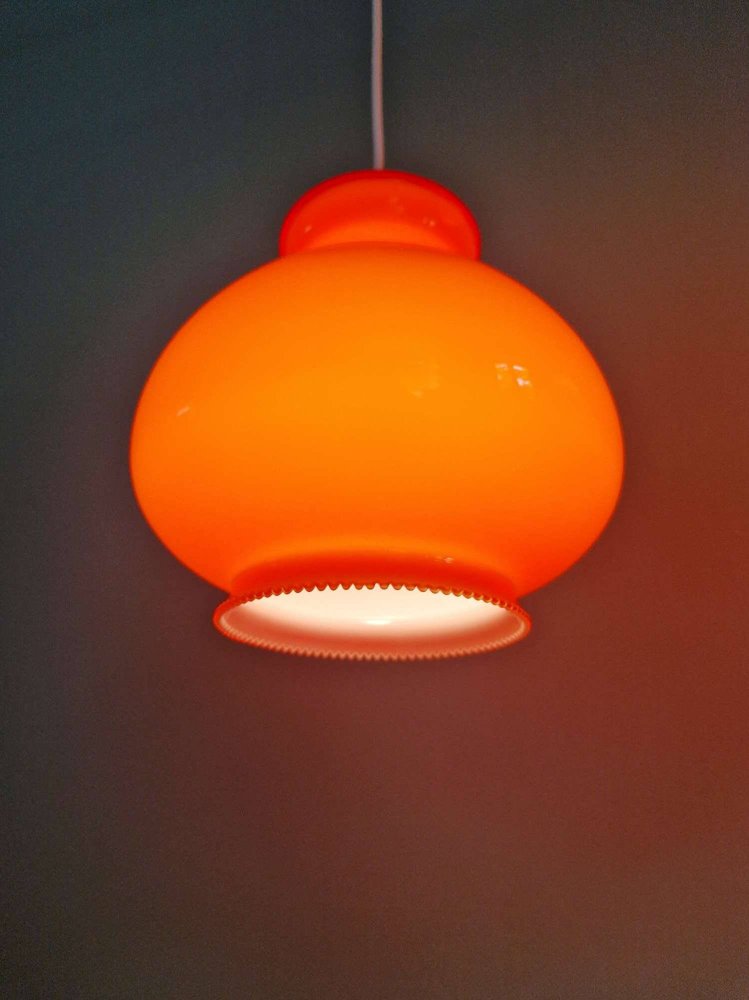 Trio of vintage orange opaline pendant lights, 1960-70