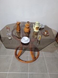 Rattan table and smoked glass