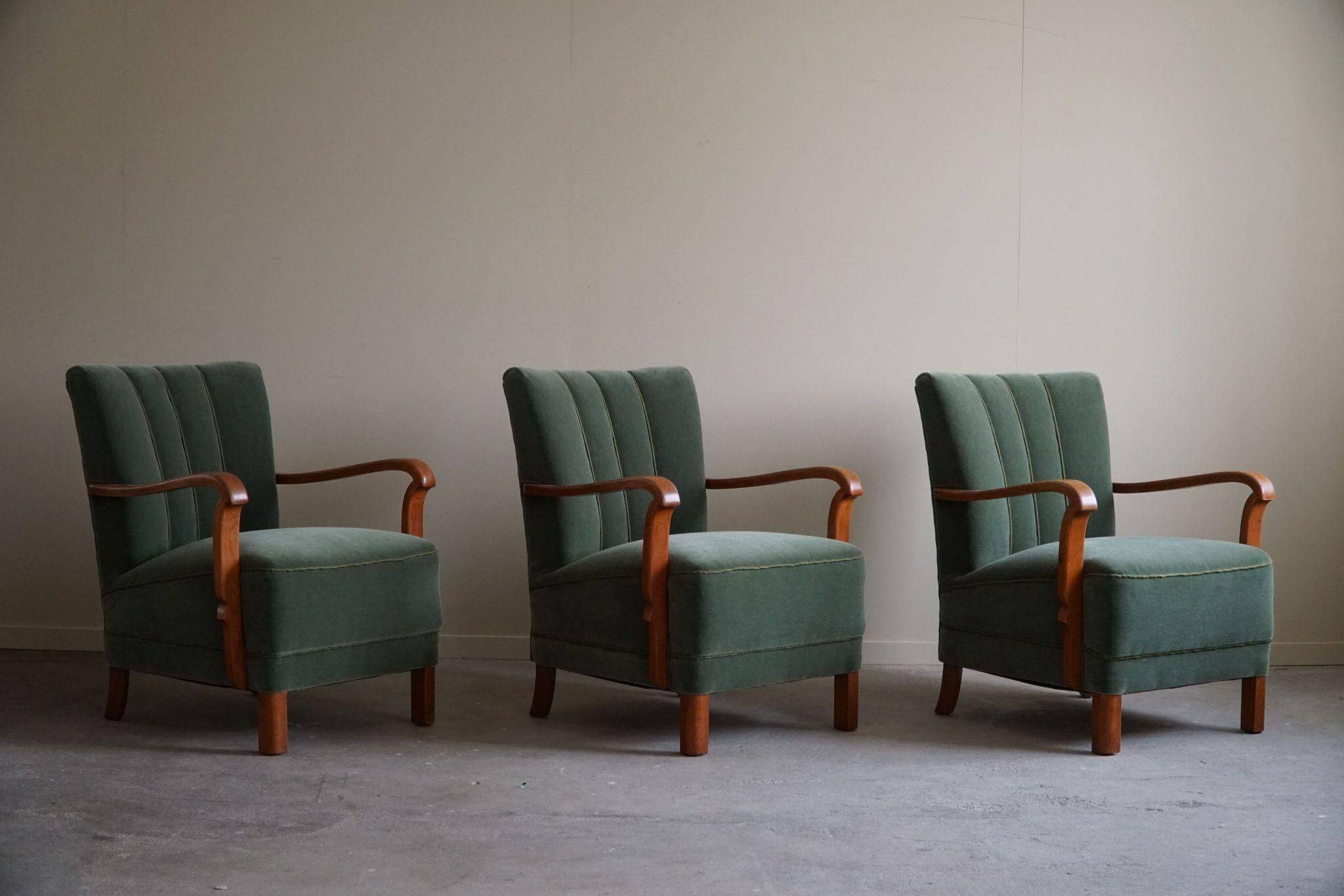 Danish Art Deco, set of 3 oak armchairs, reupholstered in green mohair, 1930s.