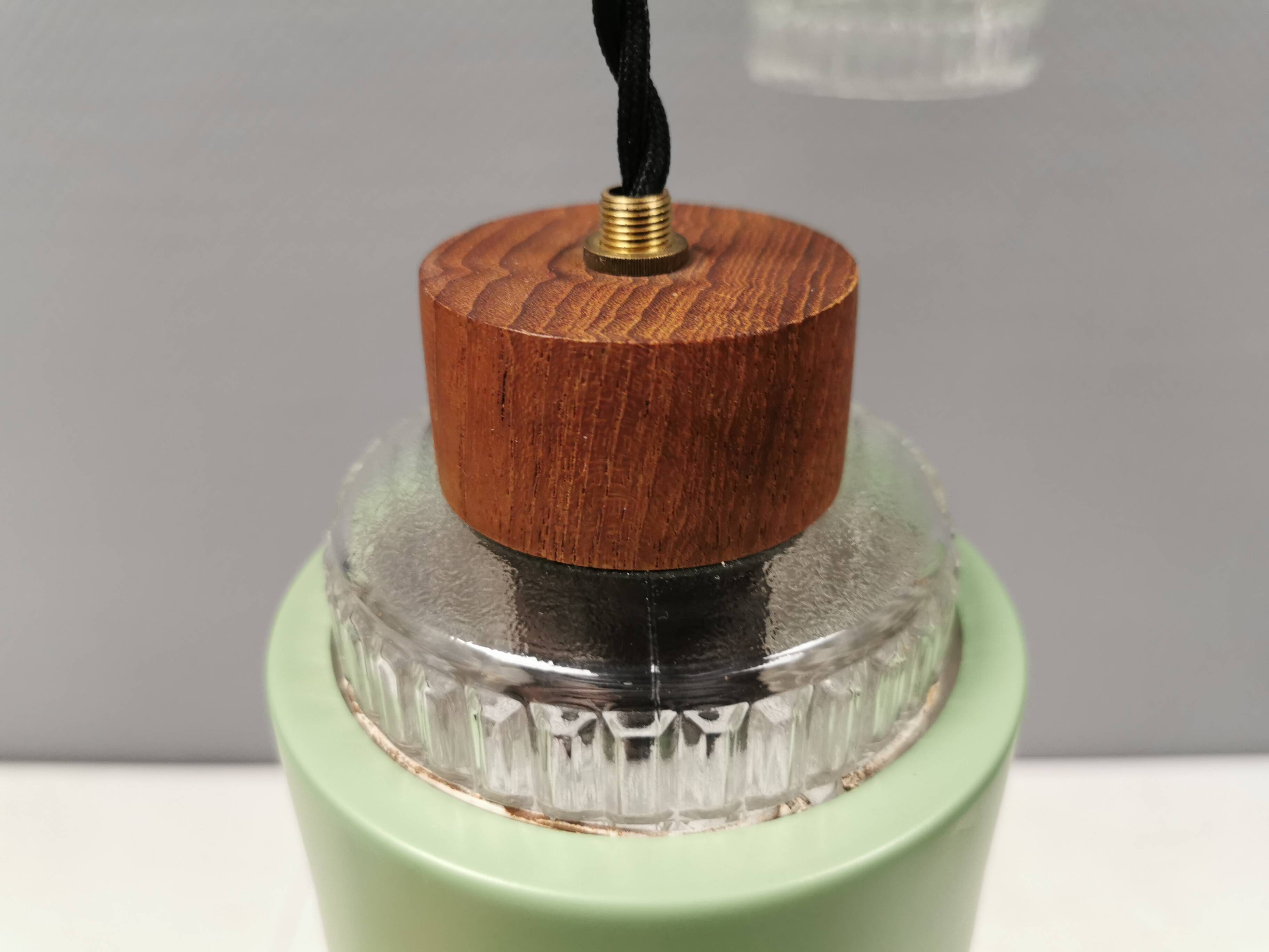 Three-part pendant in crystal glass, teak wood, and thin dusty green metal