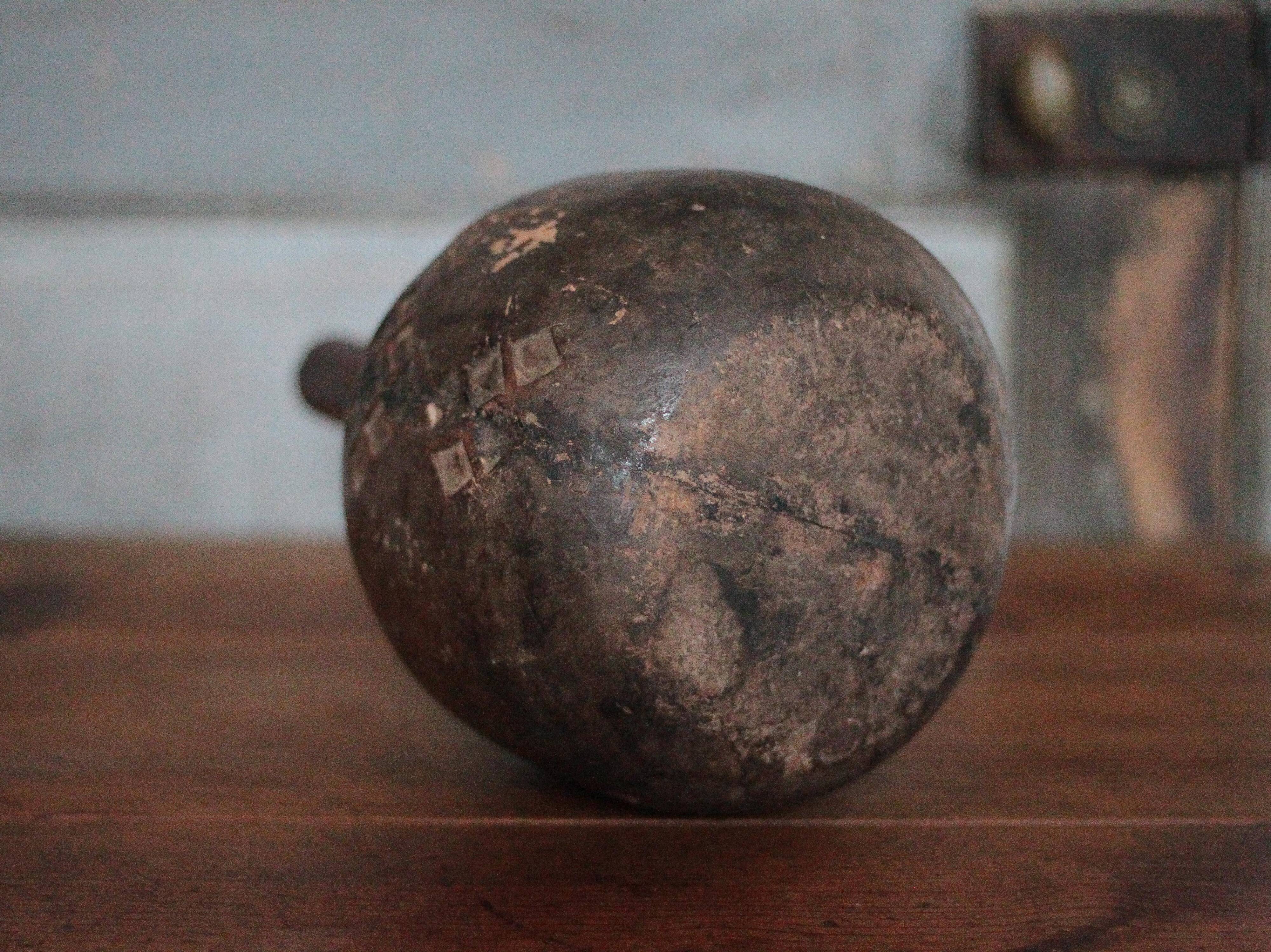 Vintage African wooden carved gourd bottle.
