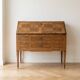 Antique wooden secretary desk with marquetry.