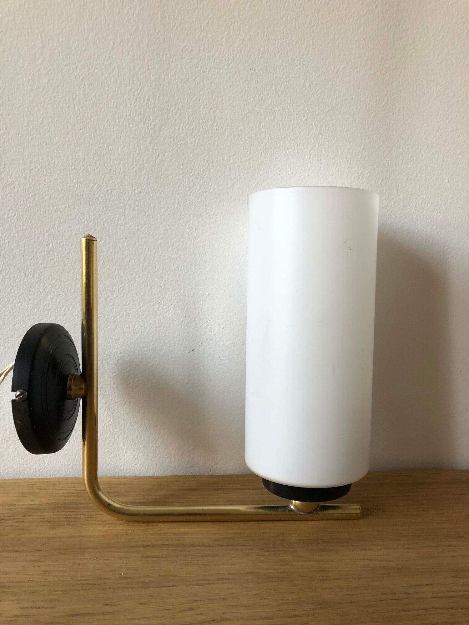 Pair of brass tube wall light and 1960s opalin glass