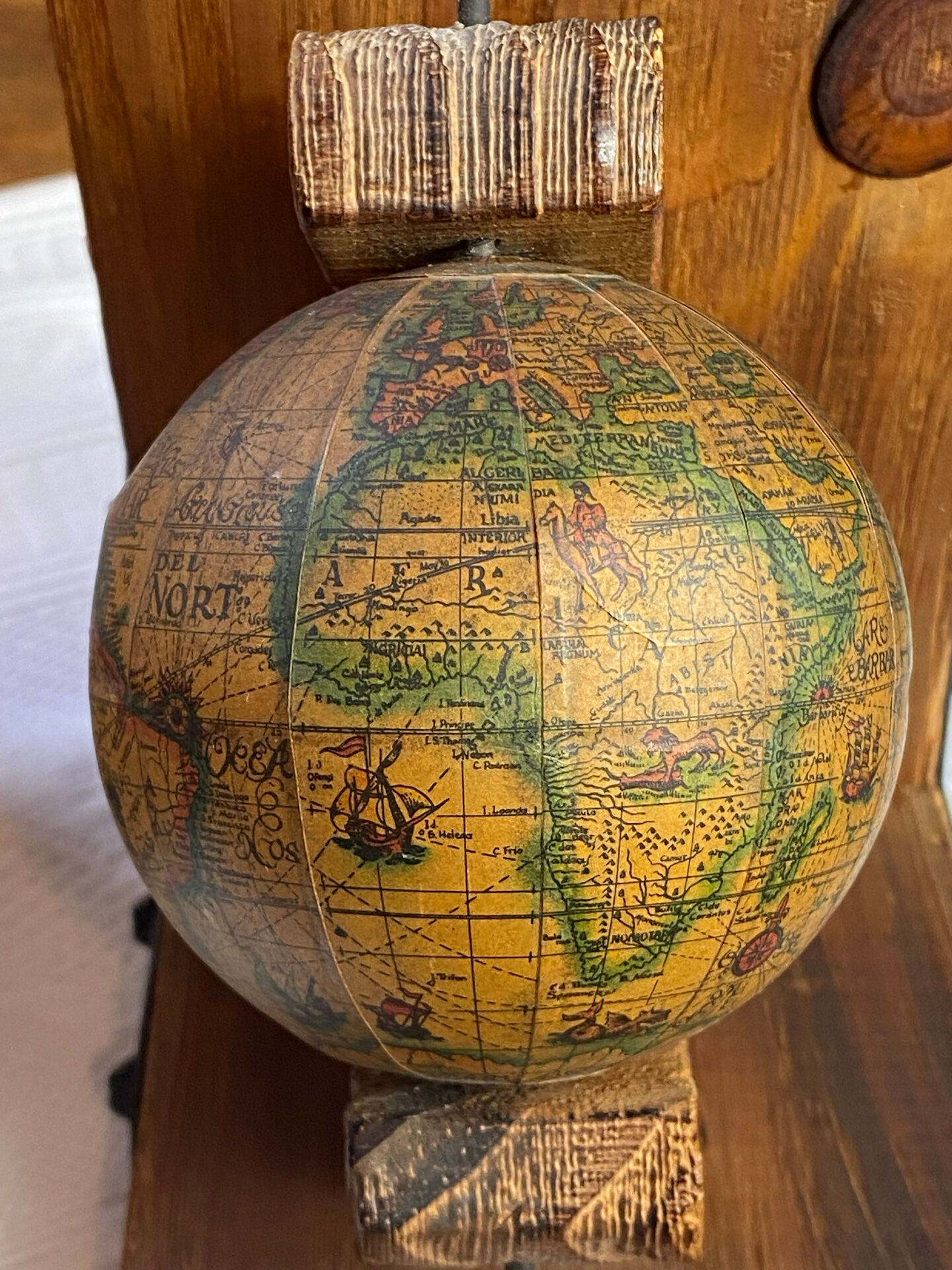 Pair of wooden bookends, rotating globes