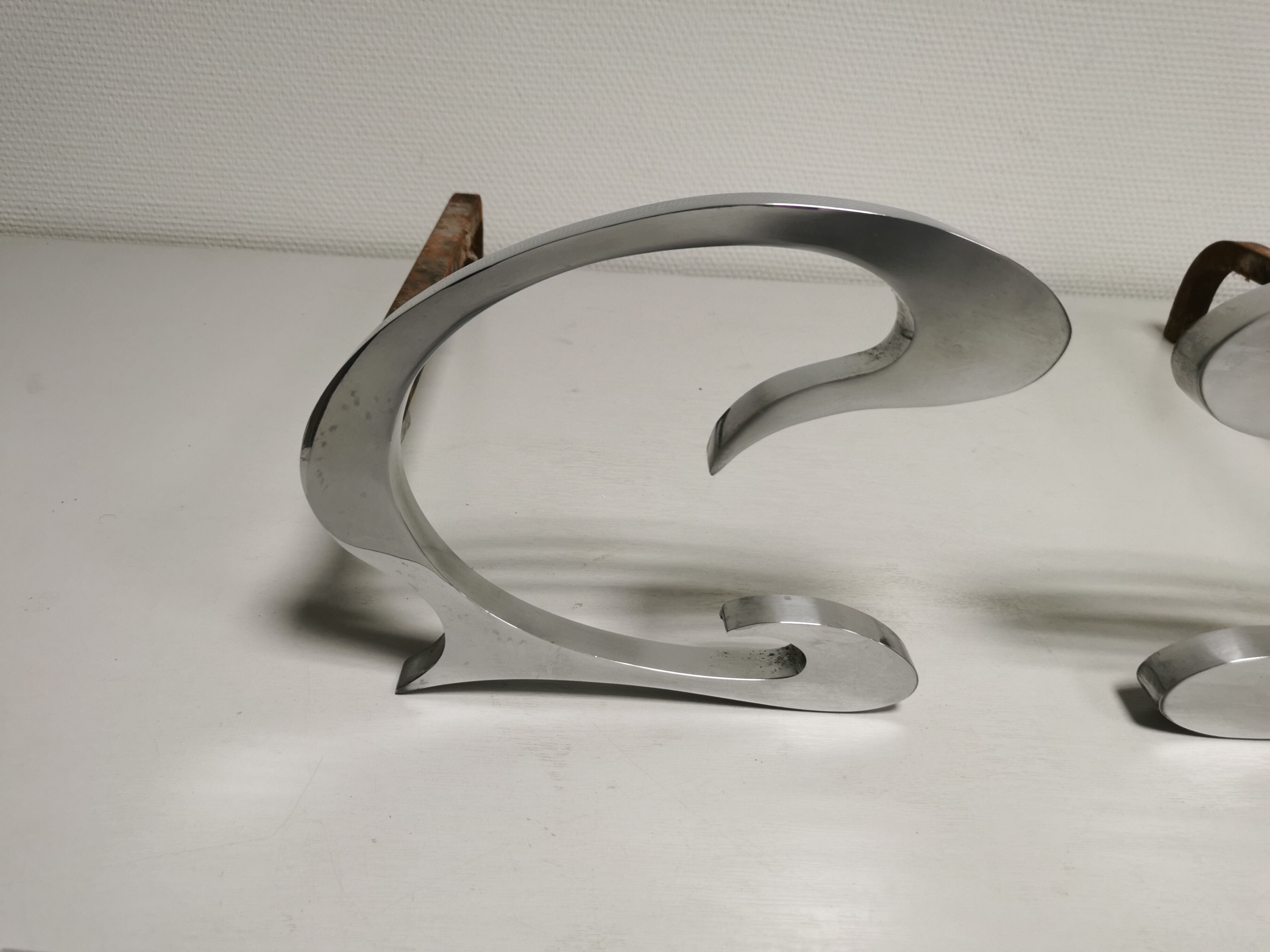 Pair of andirons in brushed steel and metal edition Jean-Paul Créations circa 1970