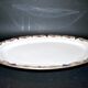 Oval dish in Limoges porcelain W.GUERIN &Cie decorated with floral garlands