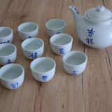 Teapot set and 9 cups with Chinese and French words