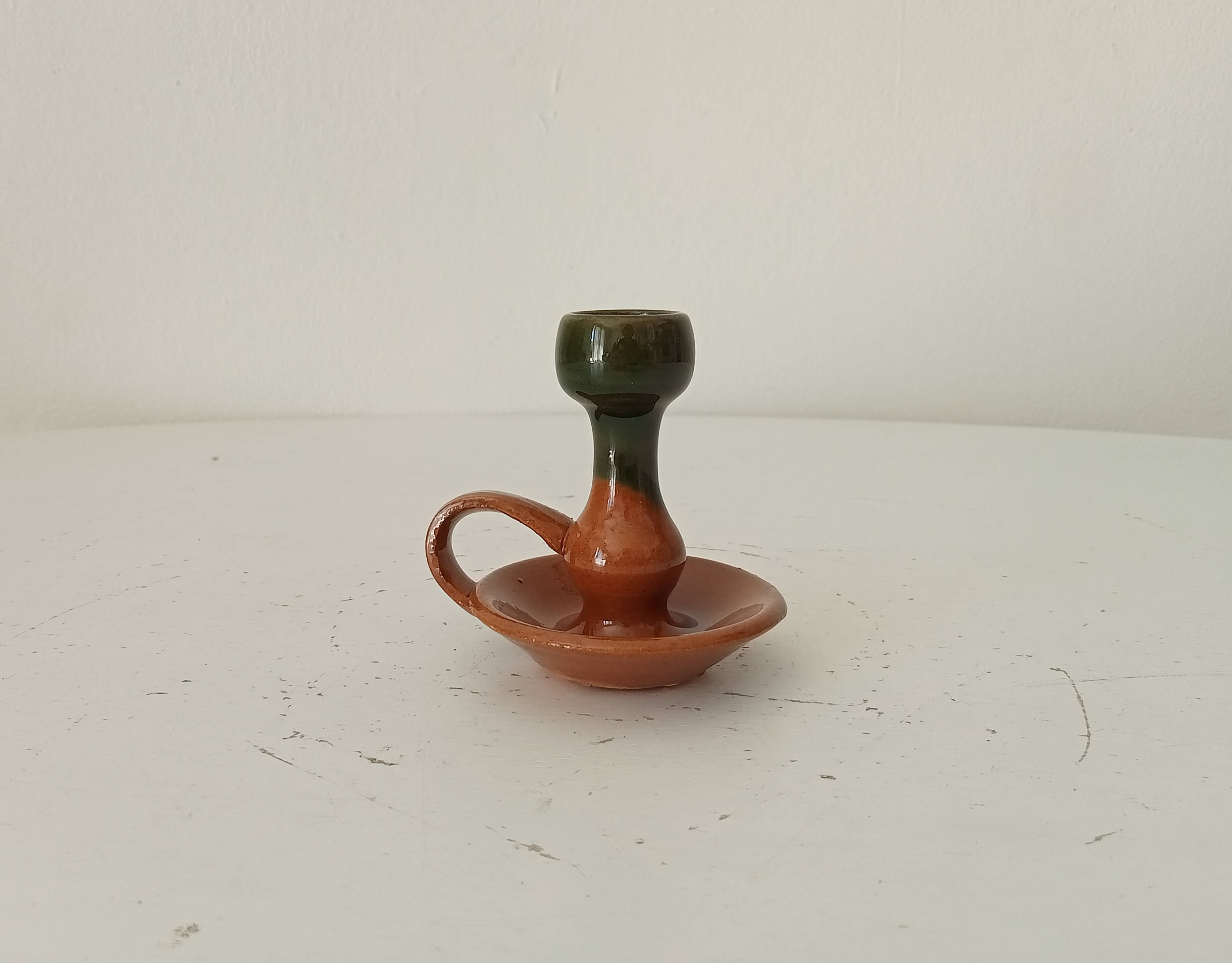 Vintage hand-held candlestick in glazed ceramic