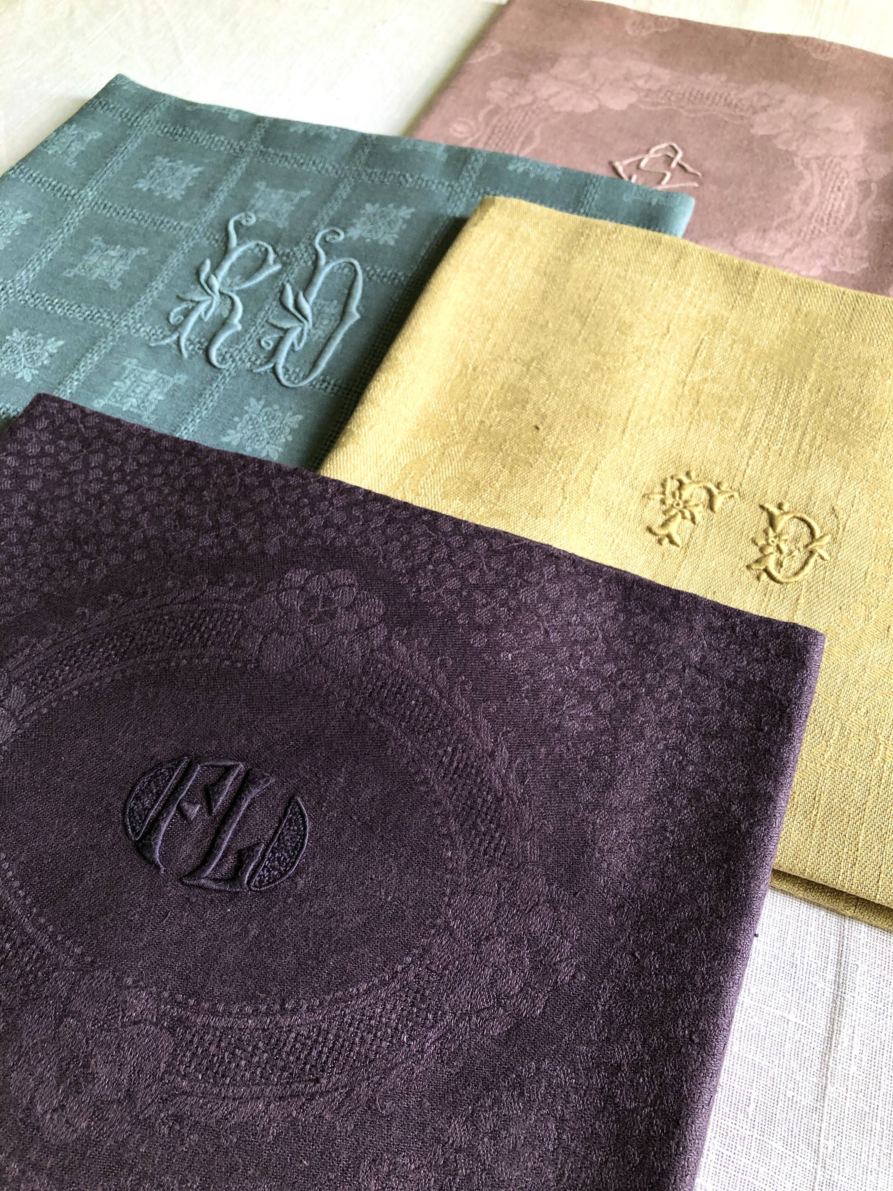 Suite of four tinted antique napkins