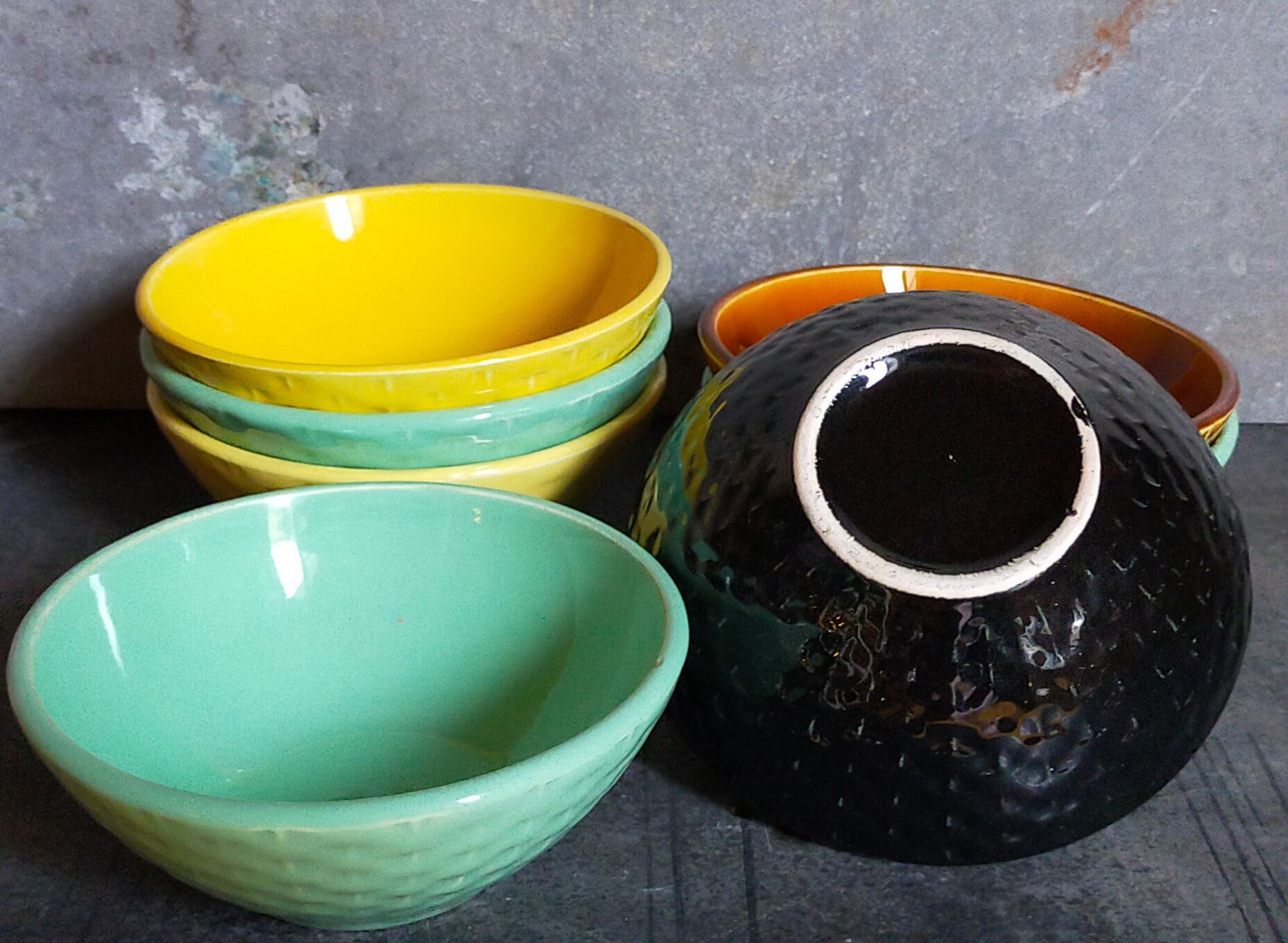 Seven vintage slip ceramic bowls