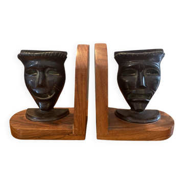 Pair of bronze bookends with masks