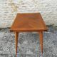 Oak table has two vintage extensions
