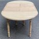 Round dining table with extendable leaves, Louis Philippe style, stripped in raw oak.