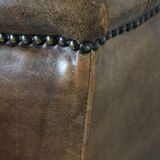 Warm, cosy and comfortable vintage sheepskin ear armchair with character