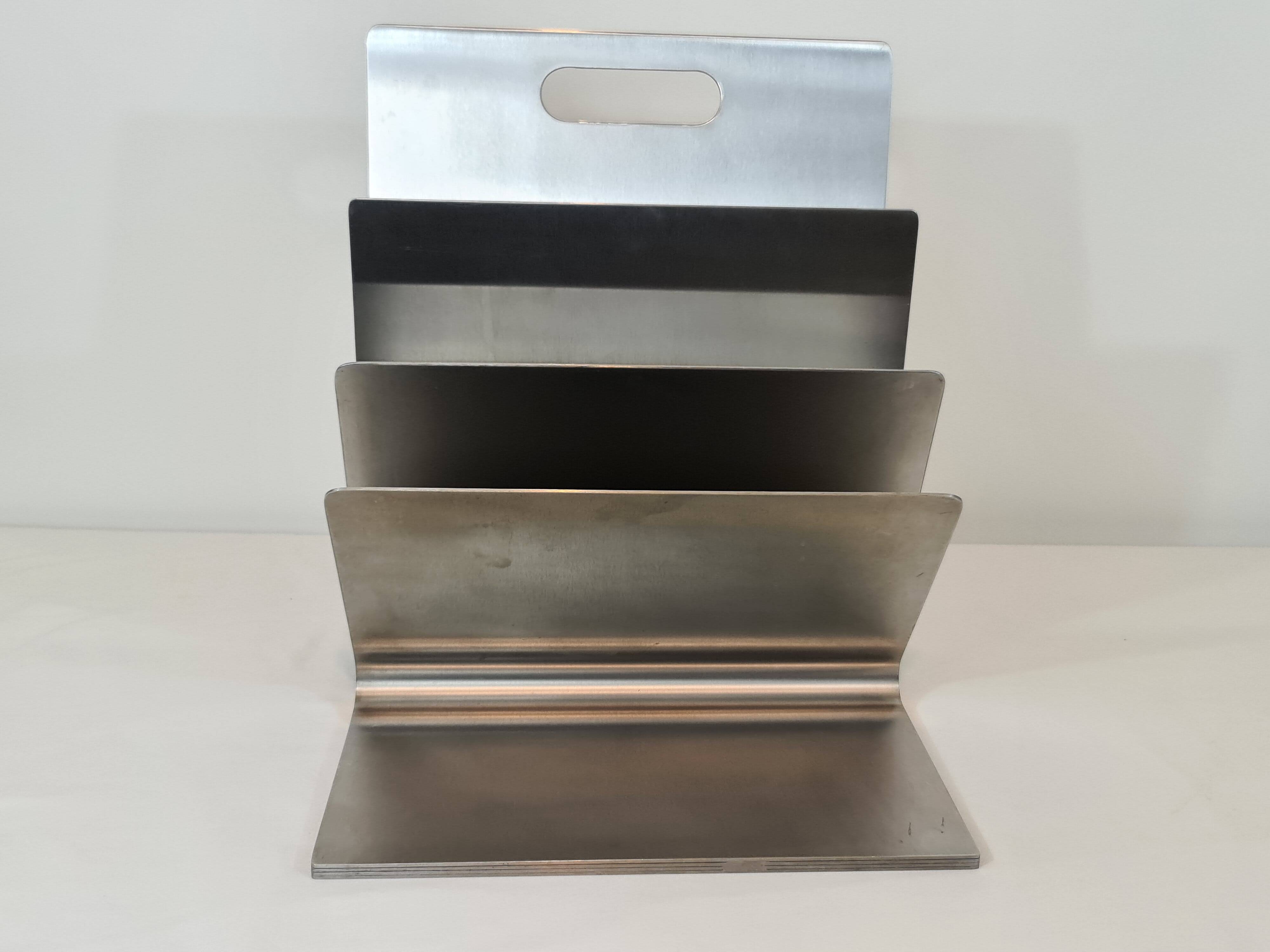 Stainless steel magazine rack by Xavier Féal for Inox Industrie 1970s