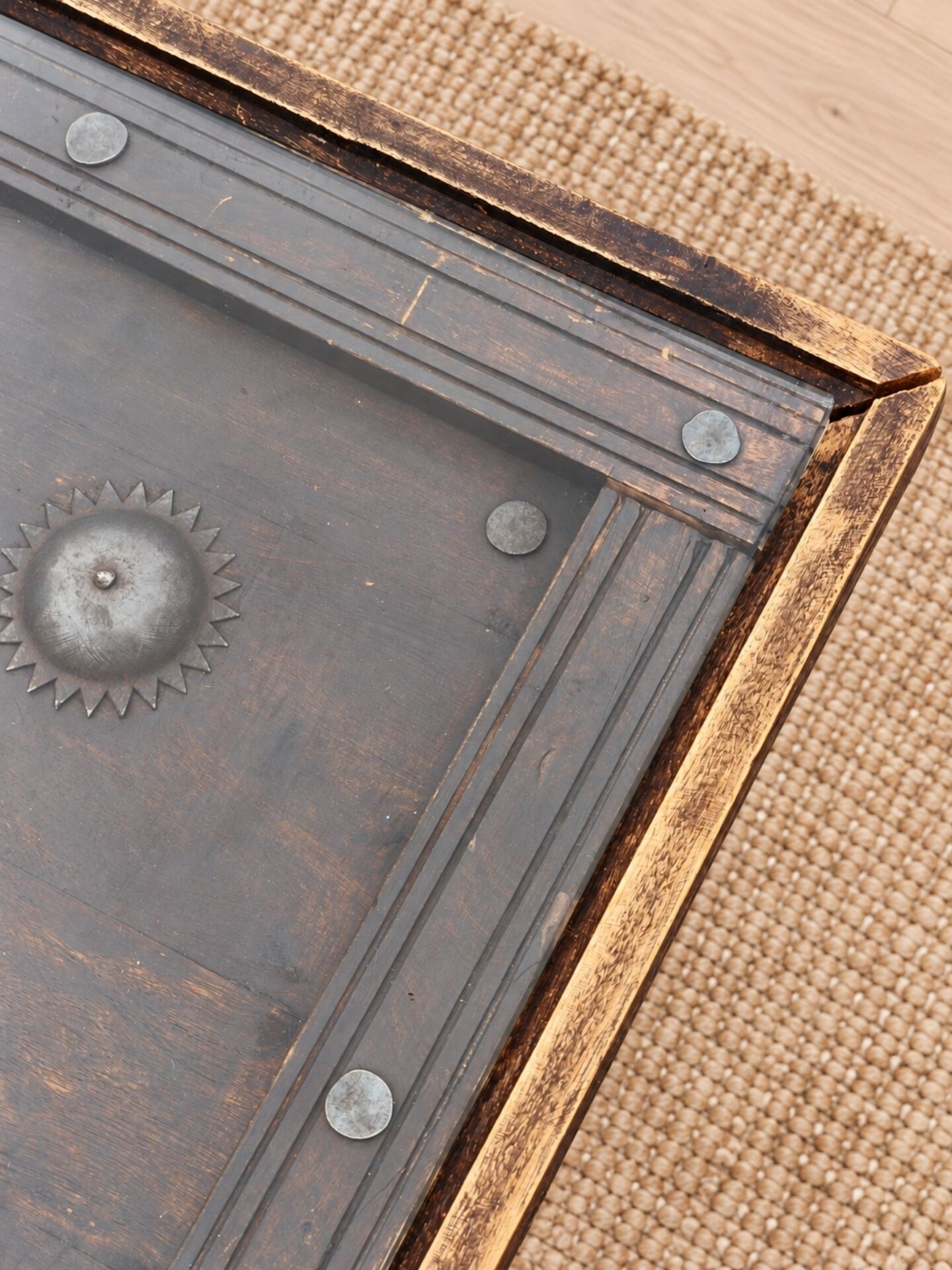 Large square vintage coffee table in wood, glass, and metal decor.