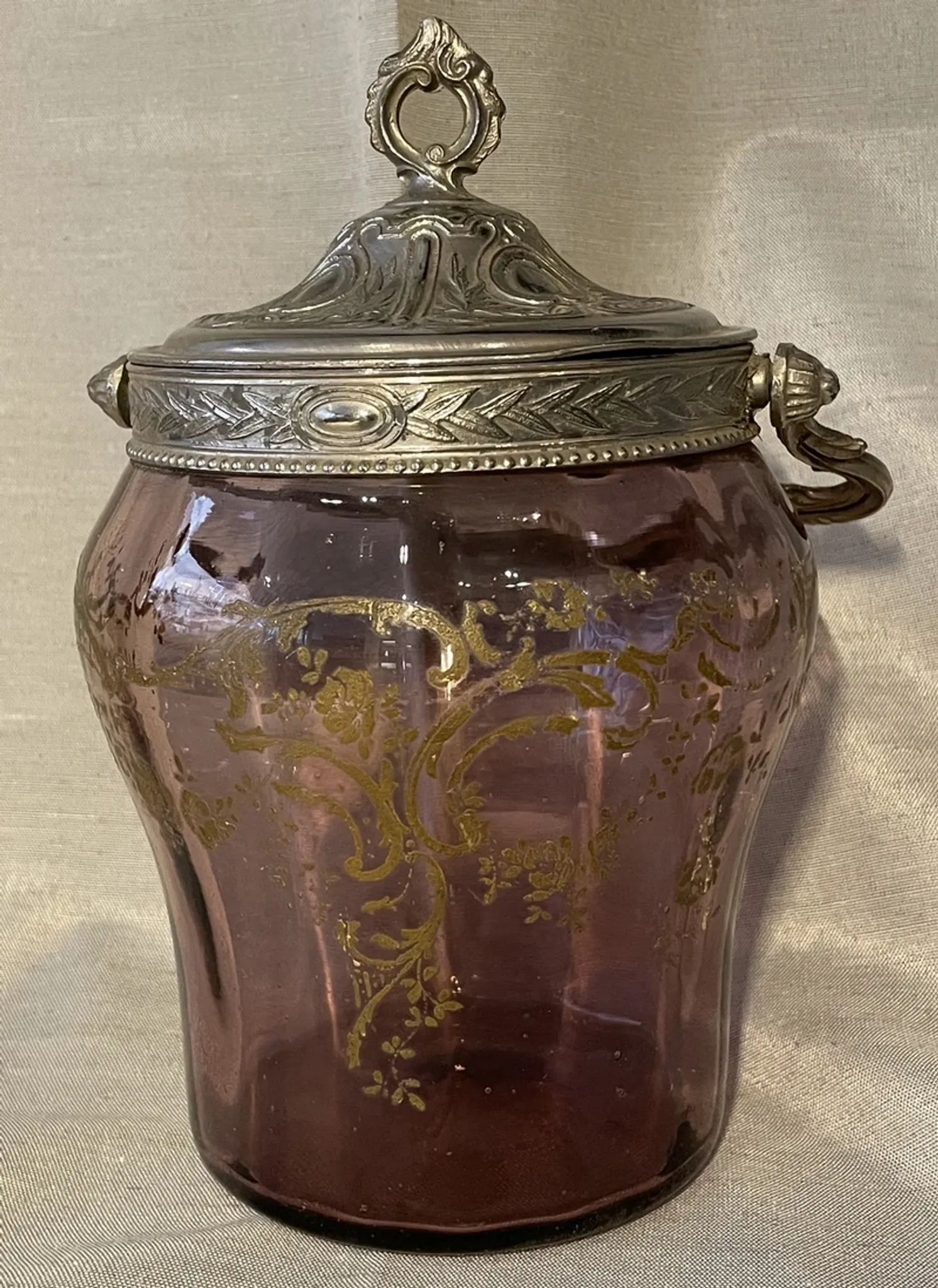 Purple glass biscuit barrel with painted gold arabesque decorations for cakes.