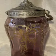 Purple glass biscuit barrel with painted gold arabesque decorations for cakes.