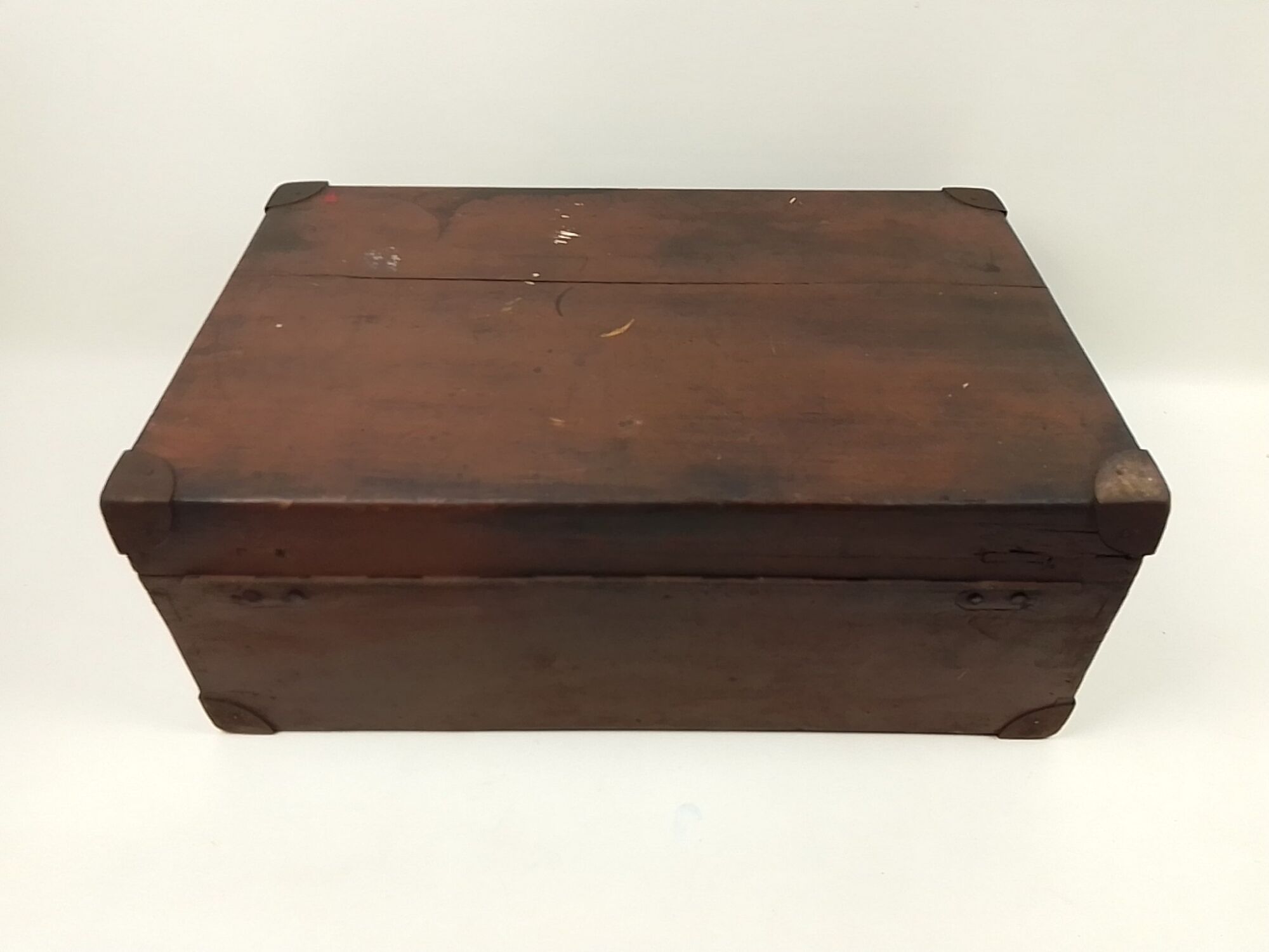 Old wooden suitcase with a padlock