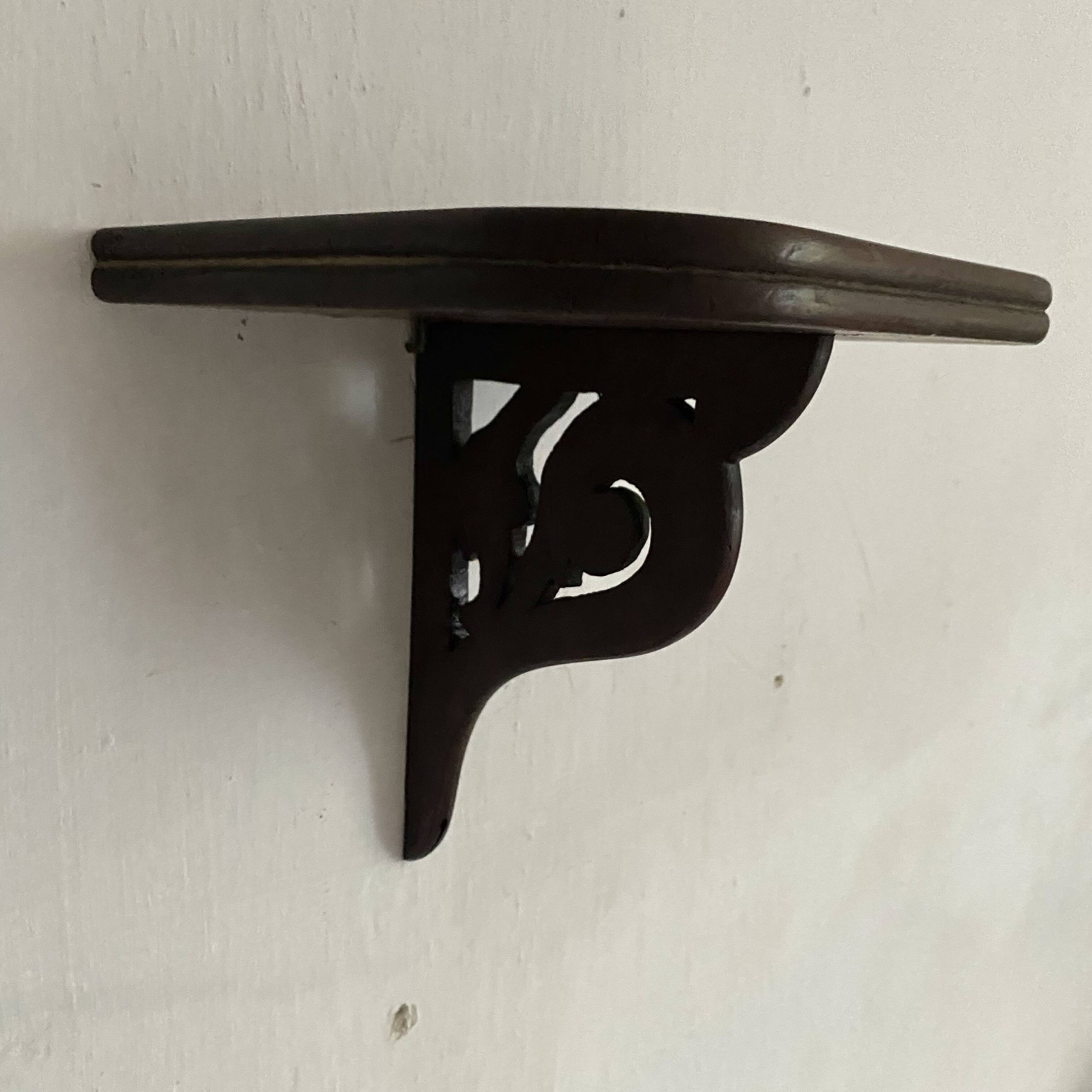 small old openwork wooden wall shelf