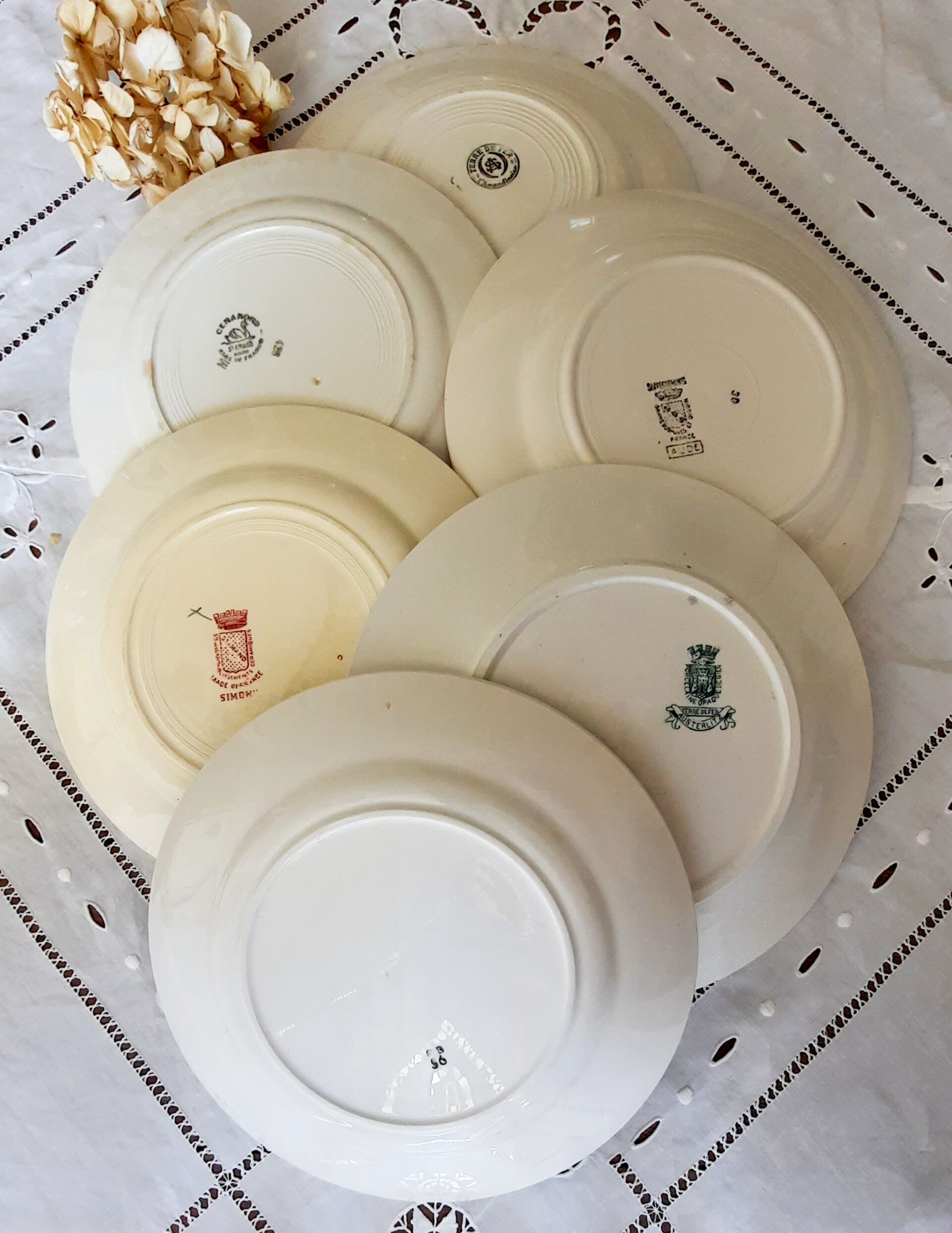 Old flat plates mismatched in earthenware